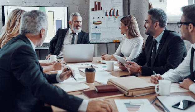 Two marketers collaborating on a campaign using a laptop